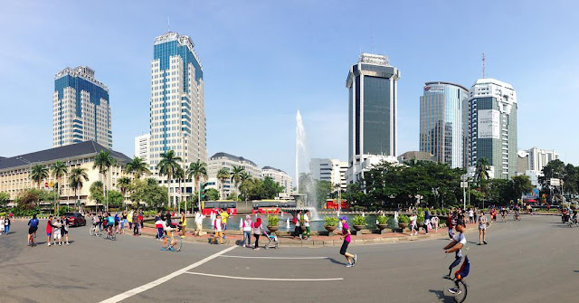 people walking near bunderan Hotel Indonesia in jakarta